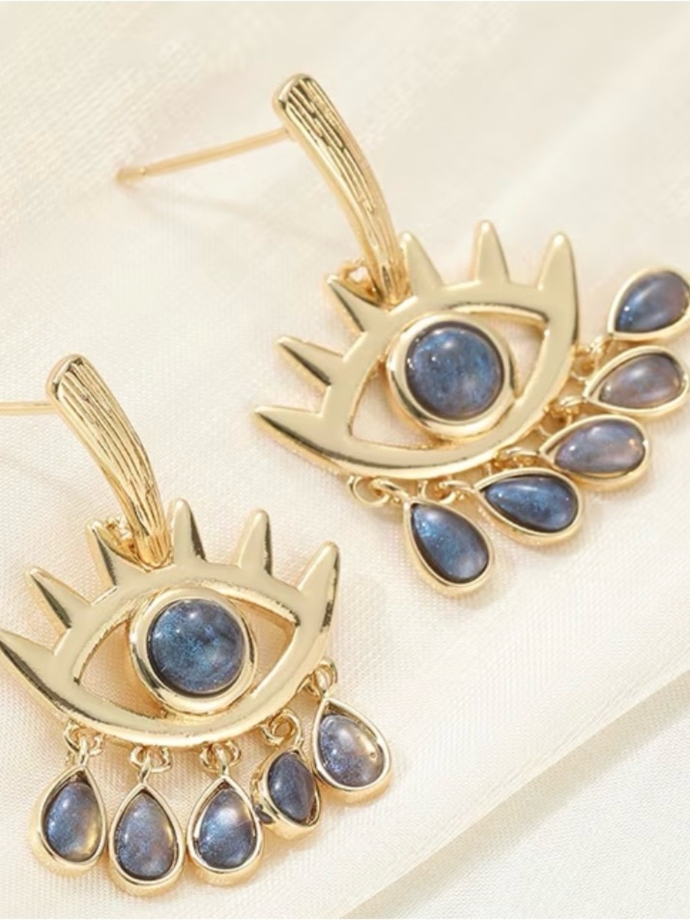 Gold Eye Drop Earrings with Blue Stone Accents